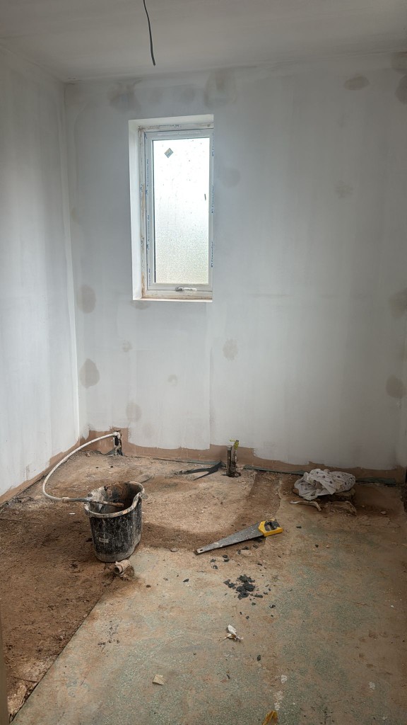 Bathroom walls filled and prepped before dustless sanding and decoration