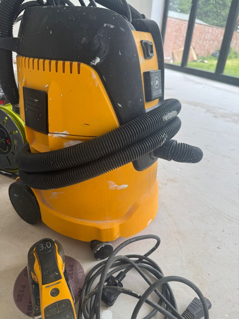 Professional dust extractor and orbital sander used for dustless sanding on a domestic painting job in Leicestershire