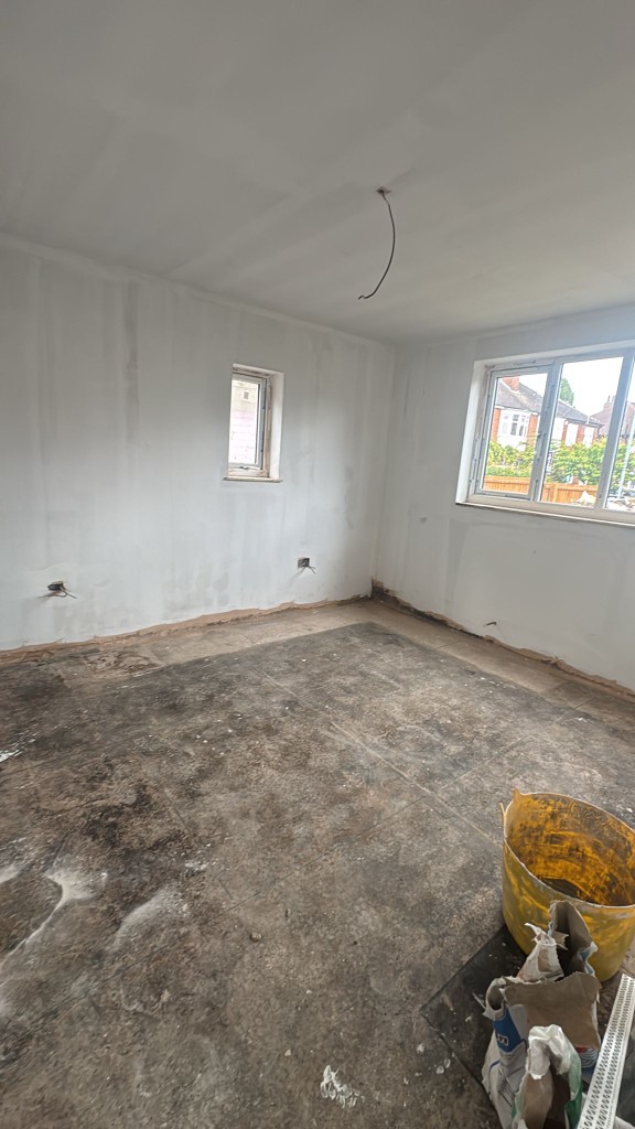 Domestic room during preparation with walls ready for sanding and painting