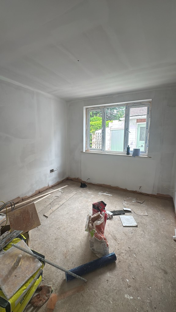 Living room renovation with floors and surfaces protected during prep work