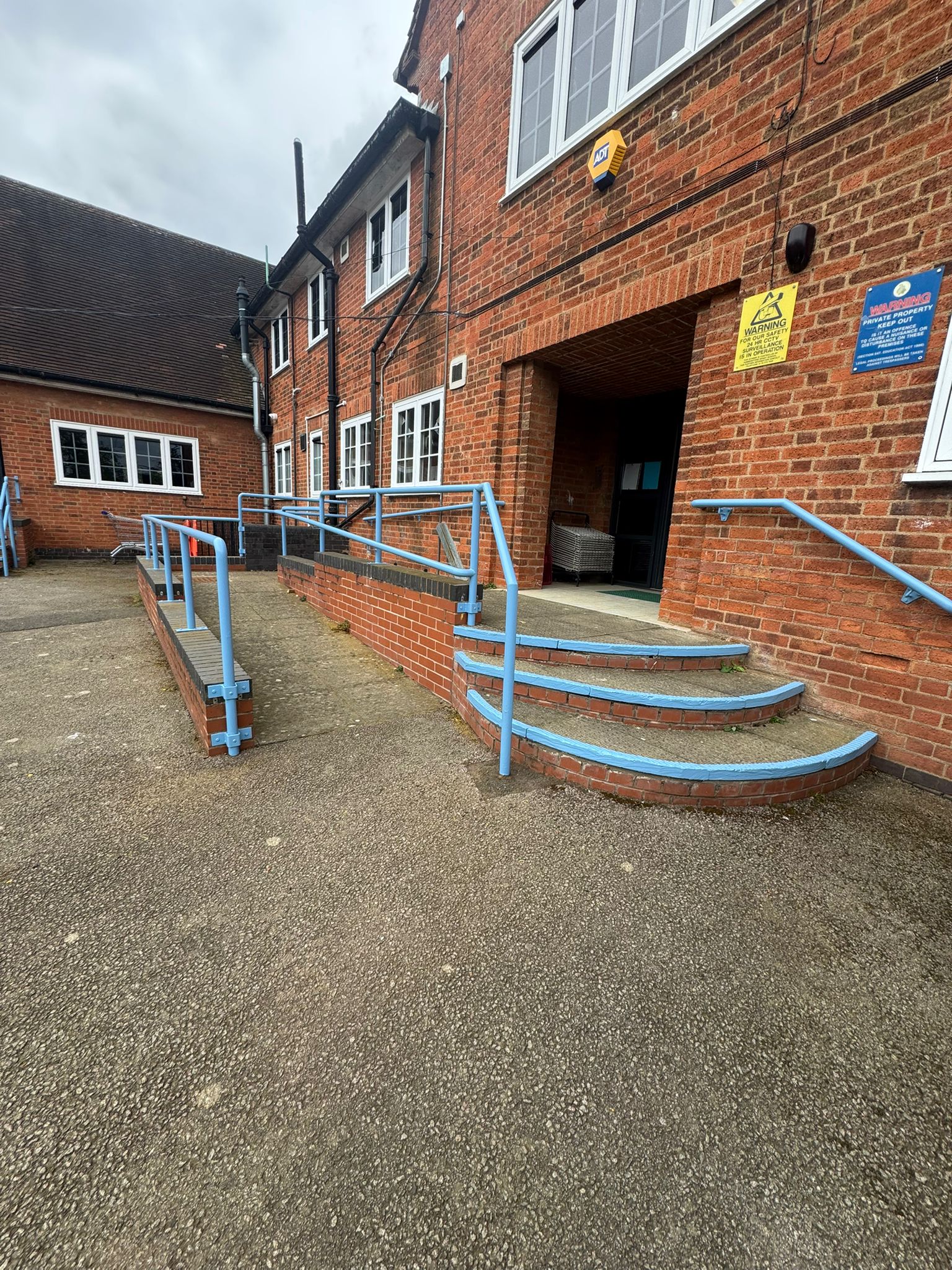 School exterior ramp and handrails with fresh blue coating
