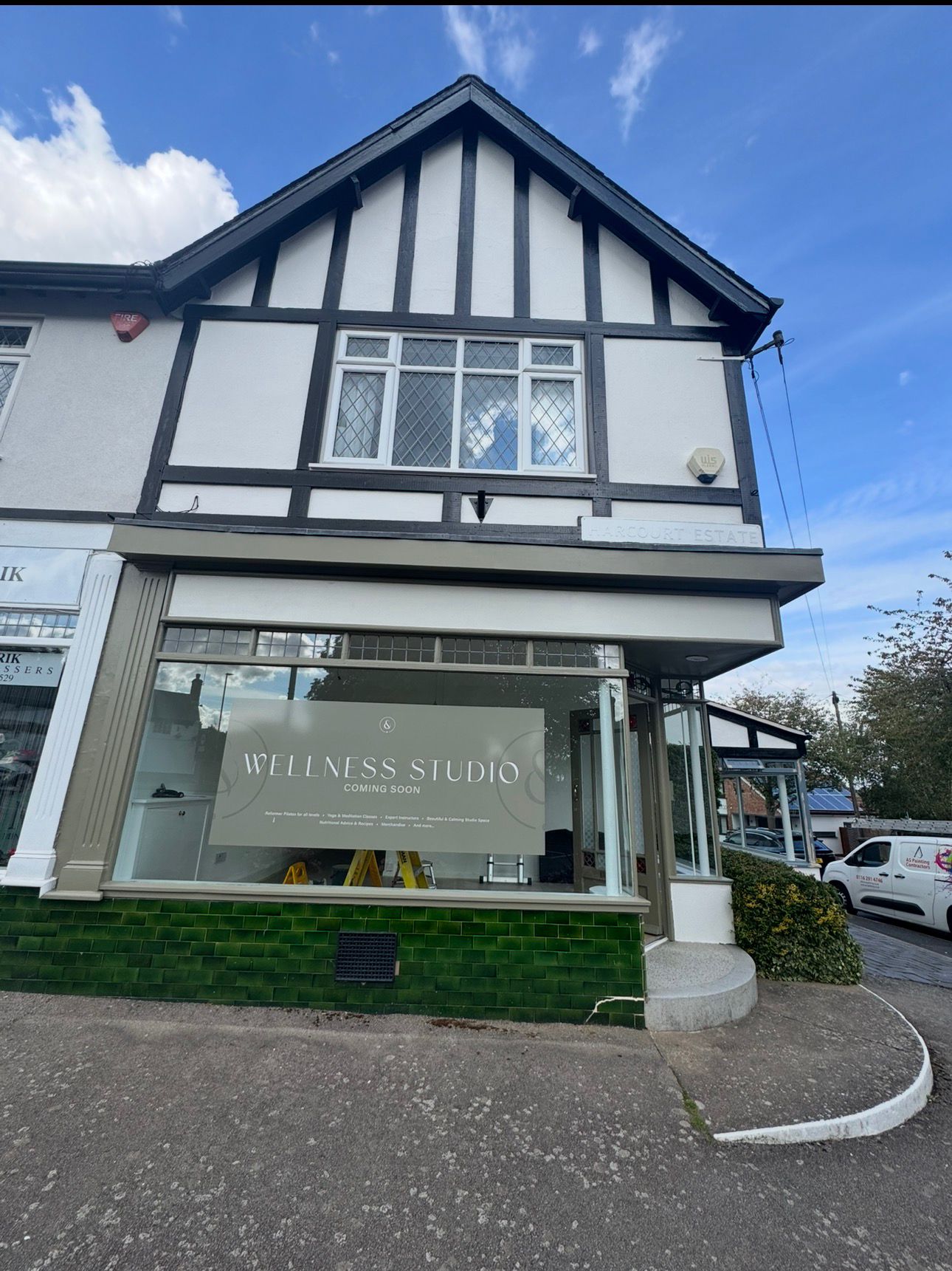 Wellness studio shopfront with crisp exterior paint finish