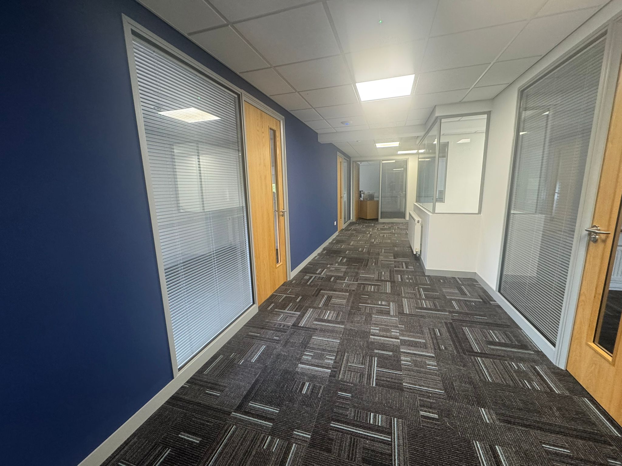 Repainted navy and white office corridor