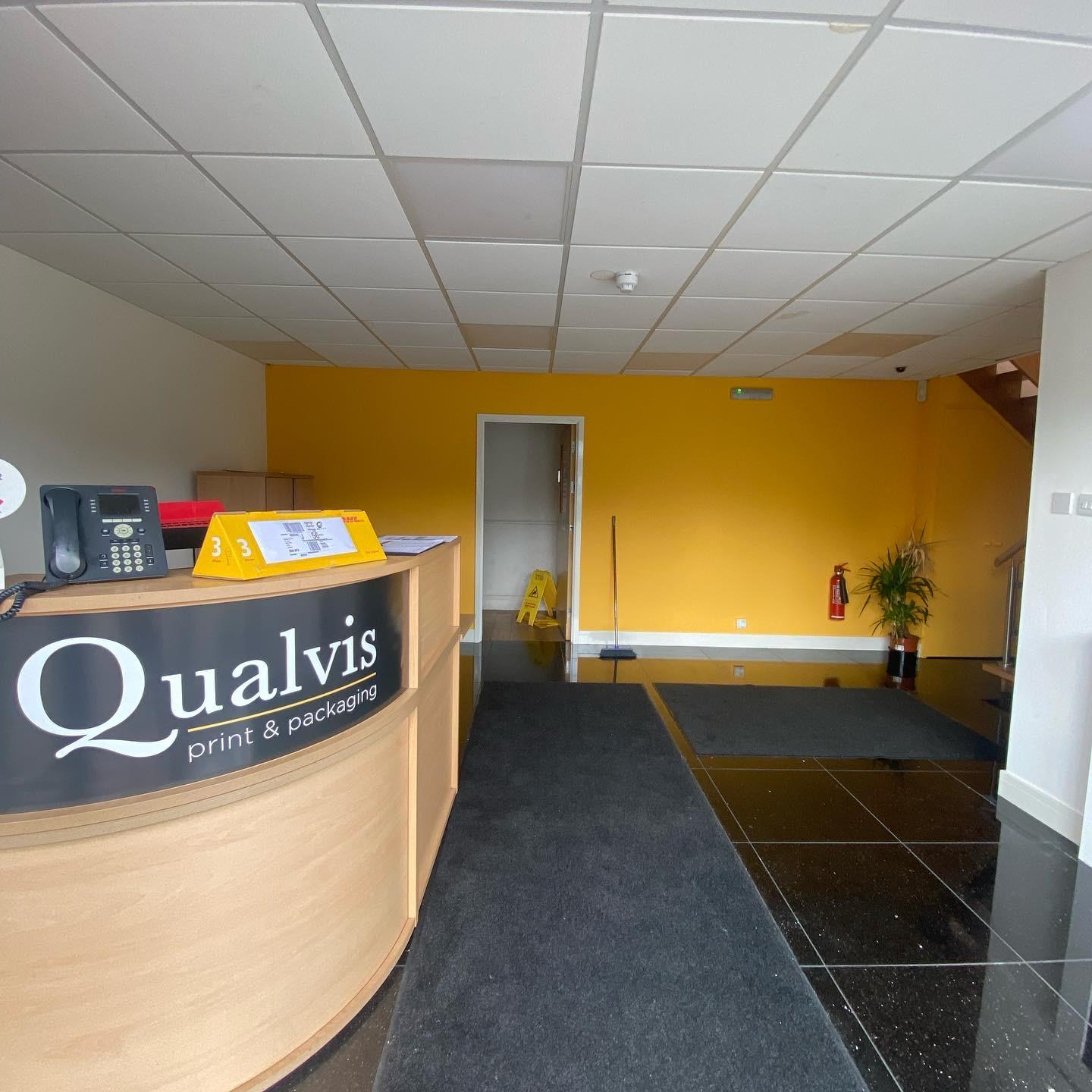 Repainted Qualvis reception with feature wall and branded signage