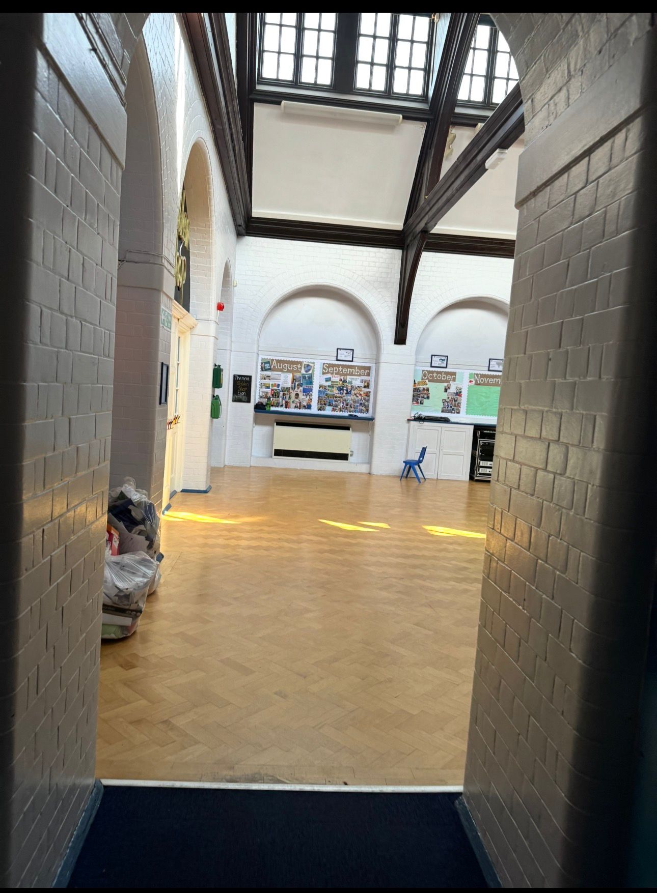 School assembly hall repainted with bright clean walls