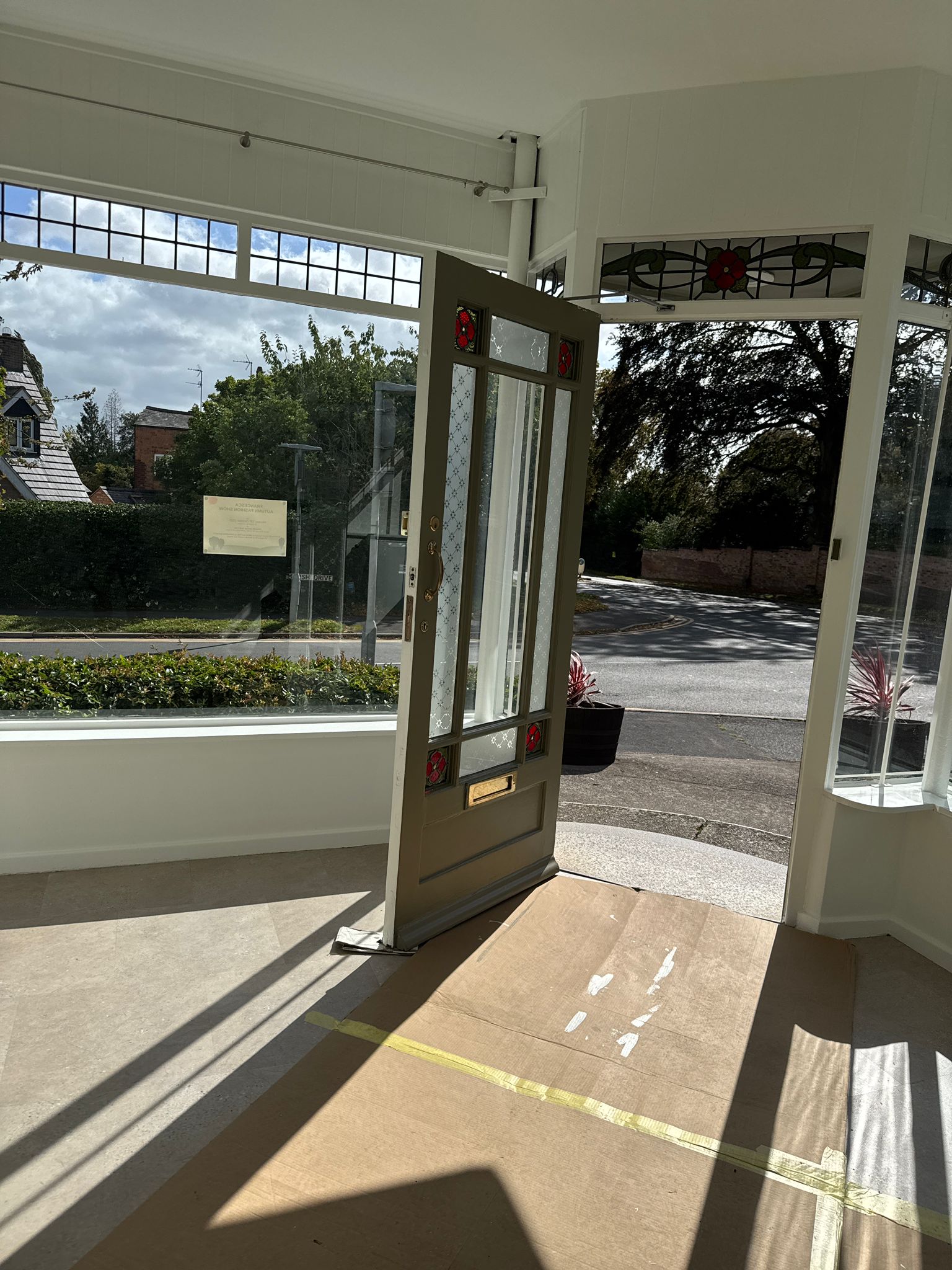 Commercial vestibule with stained glass and freshly painted joinery