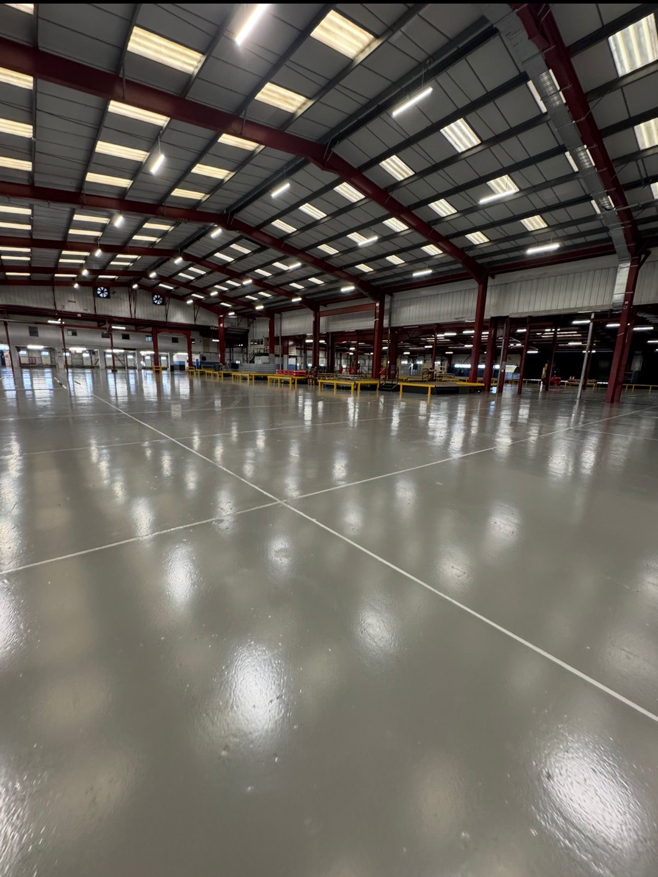 Warehouse with new epoxy resin floor and white-painted walls