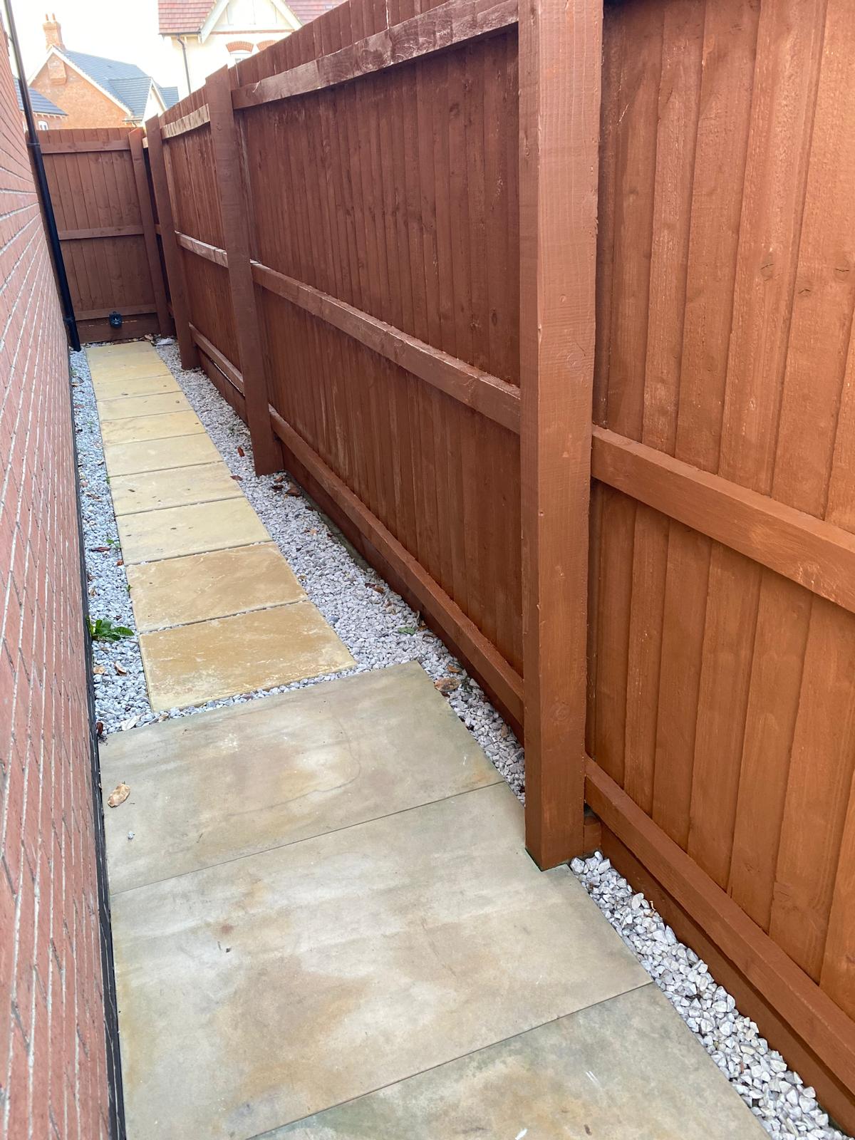 Stained timber fence with fresh protective finish