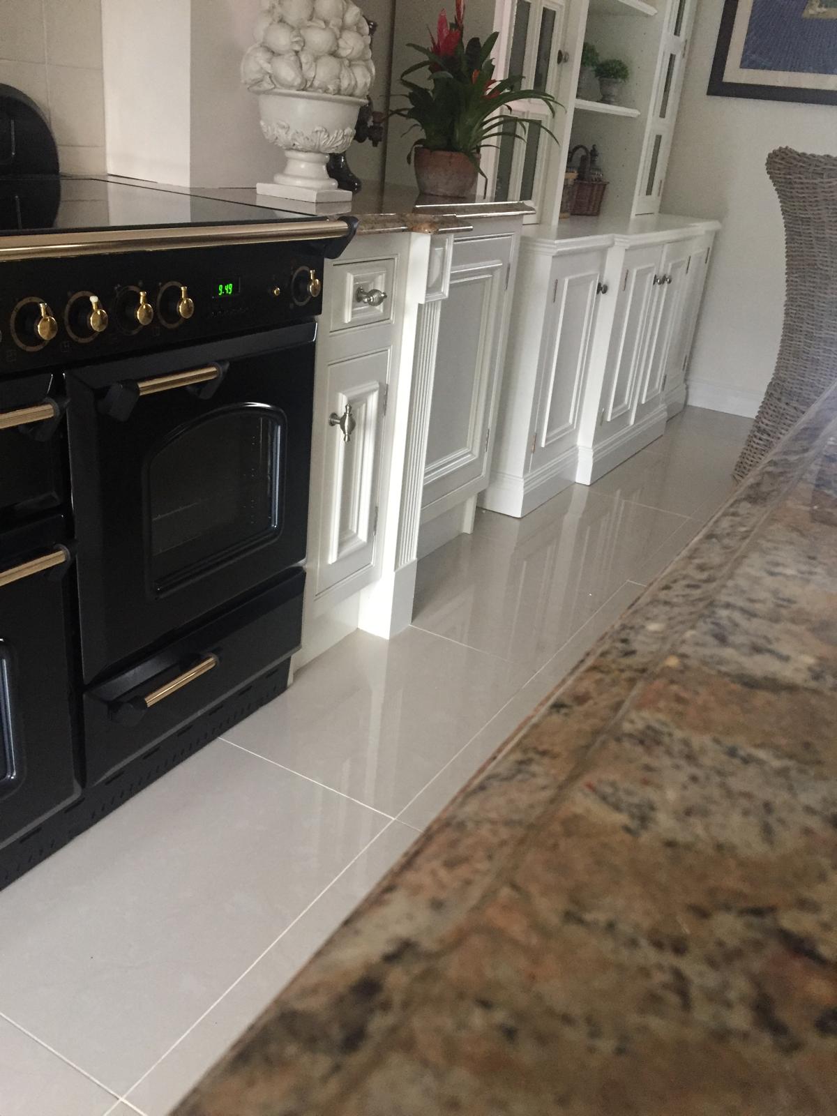 Classic kitchen with range cooker, detailed cornices and fresh paintwork