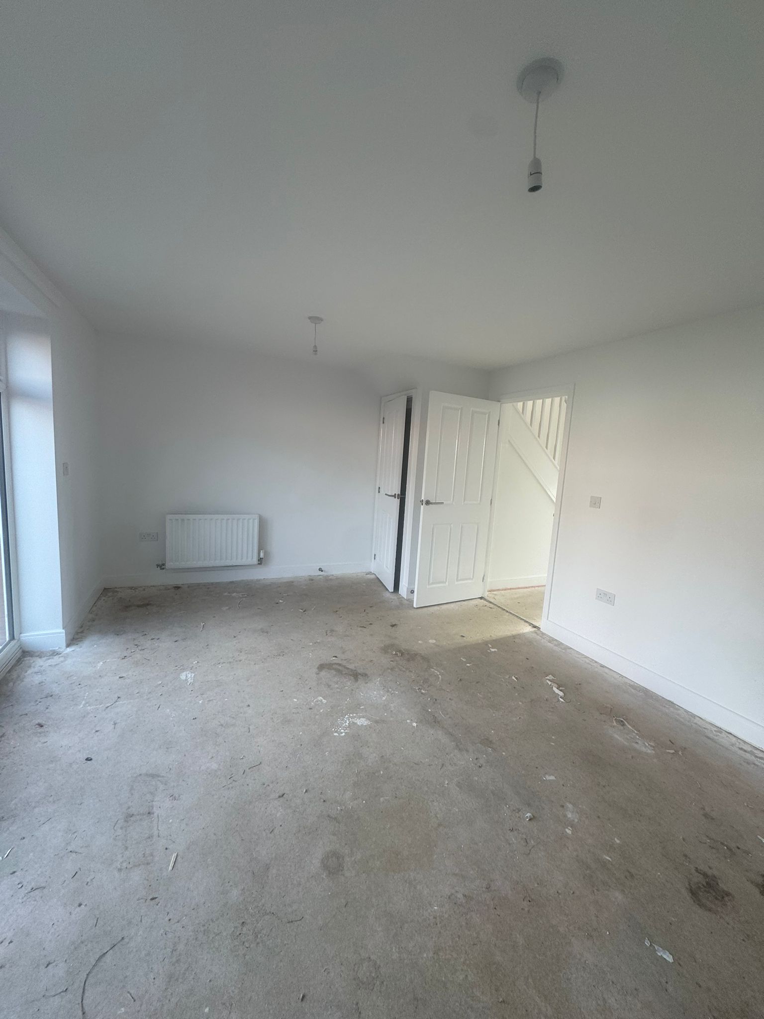 New-build living room with fresh neutral walls and trim