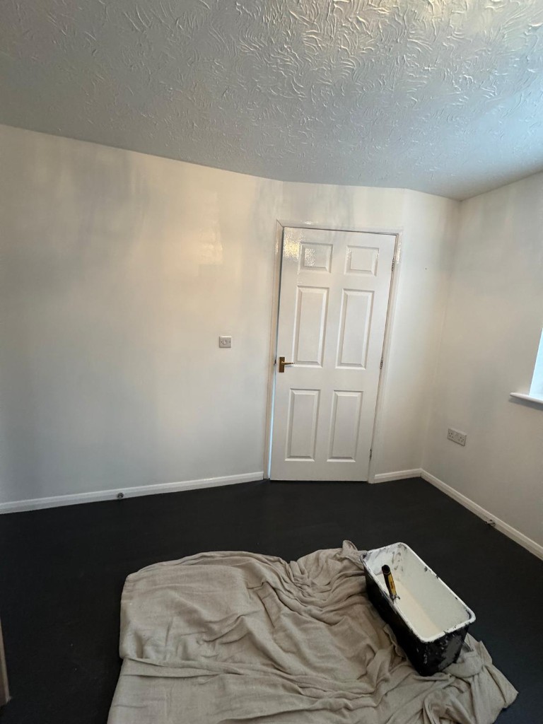Bedroom walls and woodwork repainted with trade materials during responsive decoration