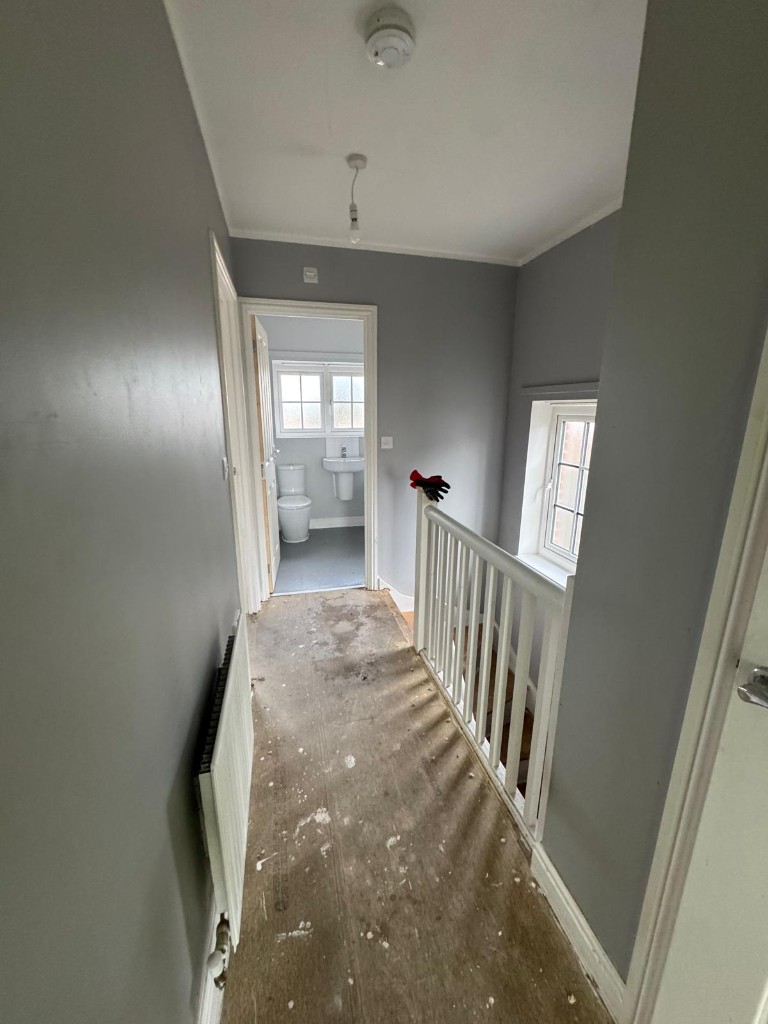 Repainted grey landing and hallway in communal social housing areas